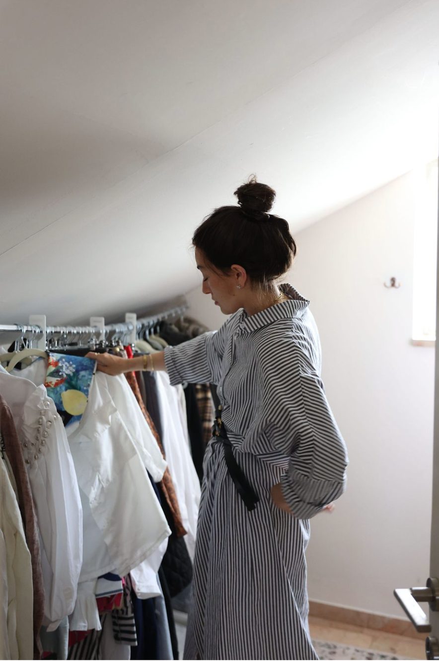 Tova working through a client's wardrobe rack